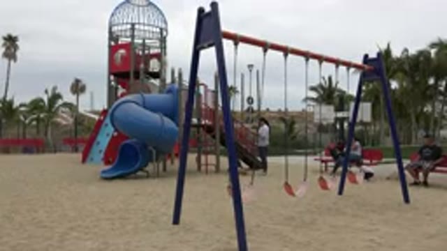 SAN JOSE DEL CABO MEXICO-2019: Child Swinging at Playground