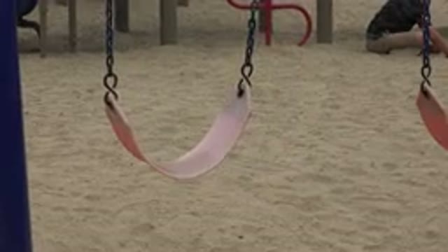 SAN JOSE DEL CABO MEXICO-2019: Swing Swaying Above Sand At A Playground With Children