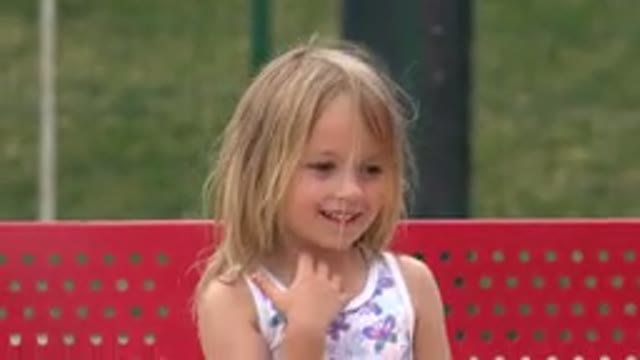 SAN JOSE DEL CABO MEXICO-2019: A Cute Little Girl Is Smiling And Sitting On A
