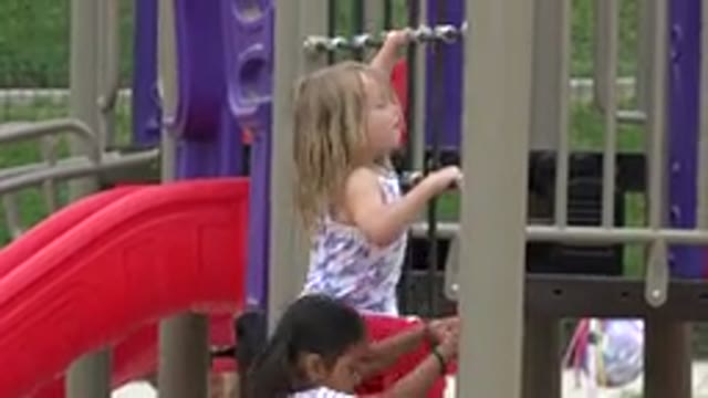 SAN JOSE DEL CABO MEXICO-2019: Two Girls On A Climbing Frame