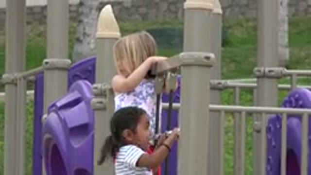 SAN JOSE DEL CABO MEXICO-2019: Two Girls Playing In The Local Playground