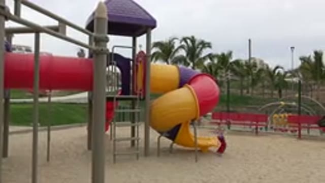 SAN JOSE DEL CABO MEXICO-2019: Two Kids Playing On The Slide In A Beautiful