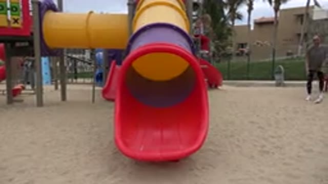 SAN JOSE DEL CABO MEXICO-2019: A Colorful Slide On The Playground With Sand