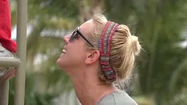 SAN JOSE DEL CABO MEXICO-2019: Blonde Woman With Red Scarf On Her Head And Playing With Child