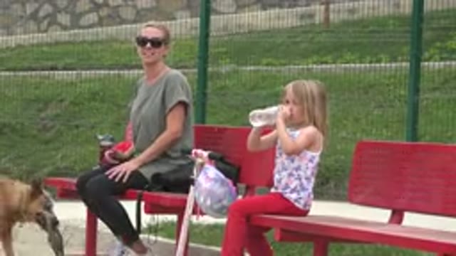 SAN JOSE DEL CABO MEXICO-2019: Mother And Daughter Sitting On A Bench With Their