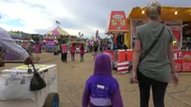 SAN JOSE DEL CABO MEXICO-2019: Mother And Child Walking Through Fairgrounds