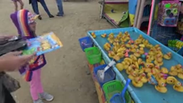 SAN JOSE DEL CABO MEXICO-2019: Mom And Daughter Date At The Carnival Winning A Prize