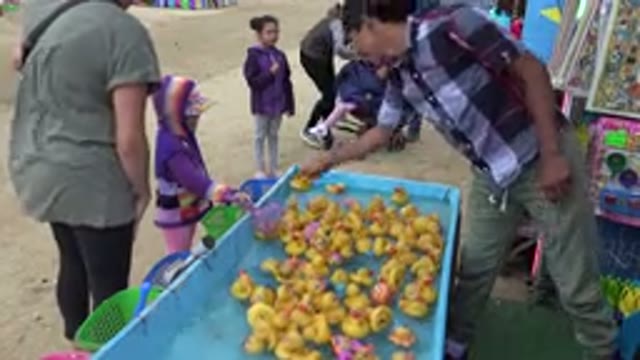 SAN JOSE DEL CABO MEXICO-2019: Small Kid Playing Fishing Toy Ducks In An