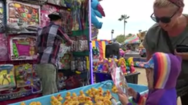 SAN JOSE DEL CABO MEXICO-2019: A Child Winning A Prize At A Carnival Game With