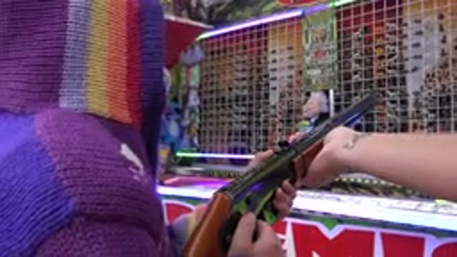 SAN JOSE DEL CABO MEXICO-2019: A Group Of People Prepare A Youth For Shooting Competition