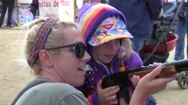 SAN JOSE DEL CABO MEXICO-2019: Mother Teaching Her Daughter To Aim And Shoot