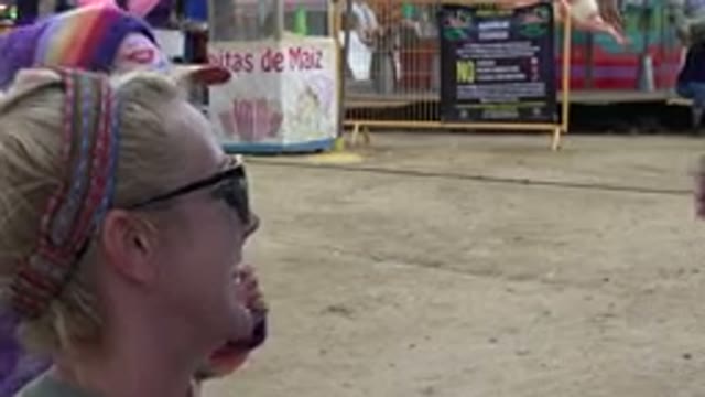 SAN JOSE DEL CABO MEXICO-2019: Woman Helps Little Girl Line Up Shot With Toy