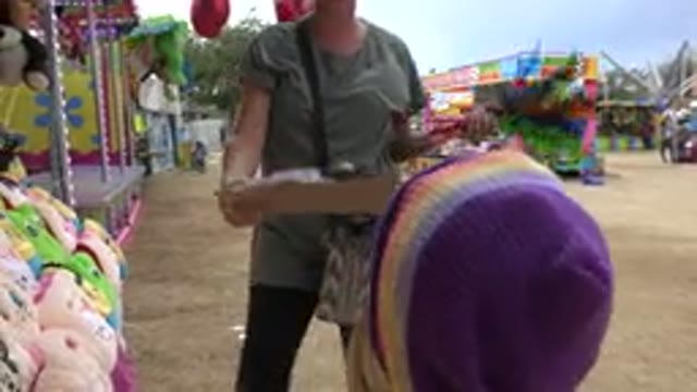 SAN JOSE DEL CABO MEXICO-2019: Mother Daughter Playing Amusement Park Stuffed Animal