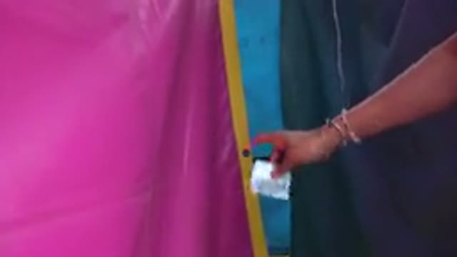 SAN JOSE DEL CABO MEXICO-2019: Pink Yellow Rimmed Thick Plastic Tarp Hanging On