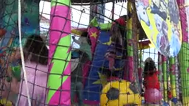 SAN JOSE DEL CABO MEXICO-2019: Children Bounce And Hop Inside Of Playground