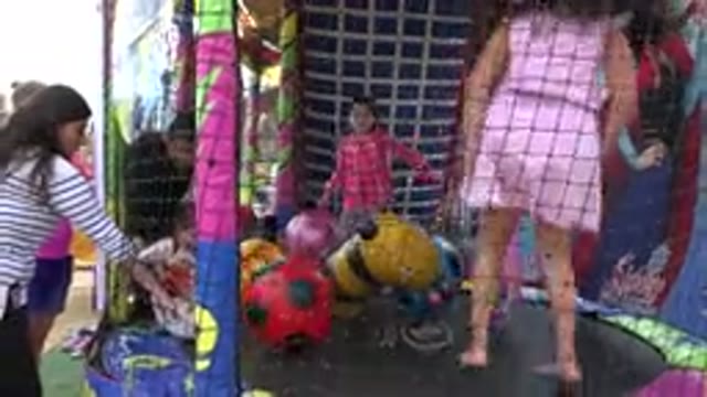 SAN JOSE DEL CABO MEXICO-2019: A Couple Of Young Children Bouncing On A Trampoline