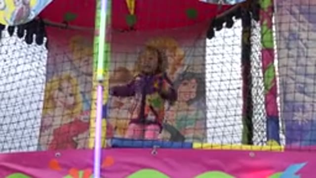 SAN JOSE DEL CABO MEXICO-2019: A Little Girl Jumping In A Trampoline Into A