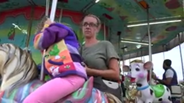 SAN JOSE DEL CABO MEXICO-2019: Mother And Daughter On The Carousel In The
