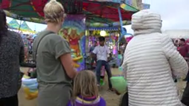 SAN JOSE DEL CABO MEXICO-2019: Adult Female And Young Female Child Are At The Carousel