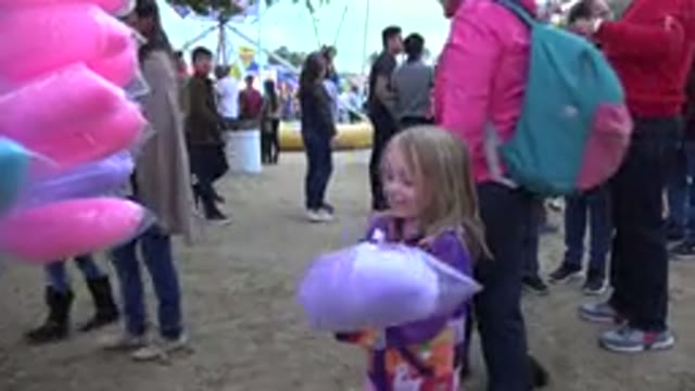 SAN JOSE DEL CABO MEXICO-2019: Girl In Park With Cotton Candy Smiling