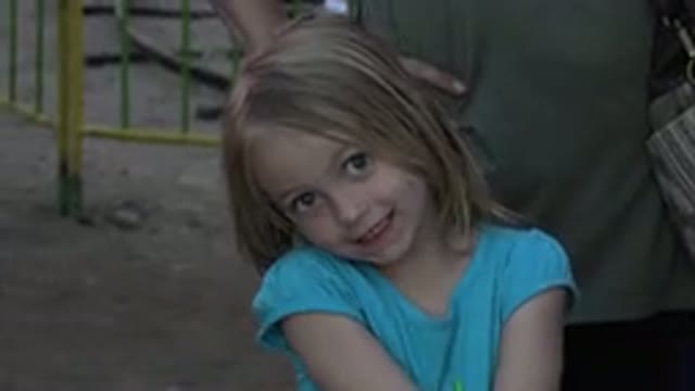 SAN JOSE DEL CABO MEXICO-2019: A Small Girl With Blonde Hair And A Blue Shirt
