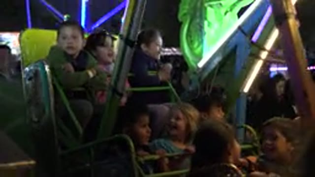 SAN JOSE DEL CABO MEXICO-2019: Kids Ride Amusement Park Attraction Under Night Lights