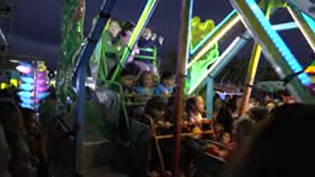 SAN JOSE DEL CABO MEXICO-2019: Kids In Car On Amusement Park Ride After Dark