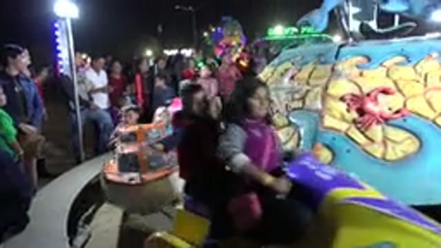 SAN JOSE DEL CABO MEXICO-2019: Kids Enjoy Riding On Merry Go Round With Boat
