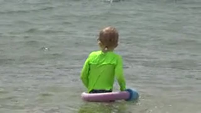 SAN JOSE DEL CABO MEXICO-2019: Children Being Filmed In The Lake While Wearing Inflatable Life Jackets