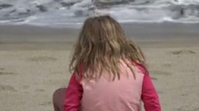 SAN JOSE DEL CABO MEXICO-2019: Young Girl Playing In The Sand By The Shore At