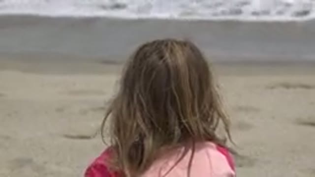 SAN JOSE DEL CABO MEXICO-2019: Little Girl Sitting Alone Staring at the Sea
