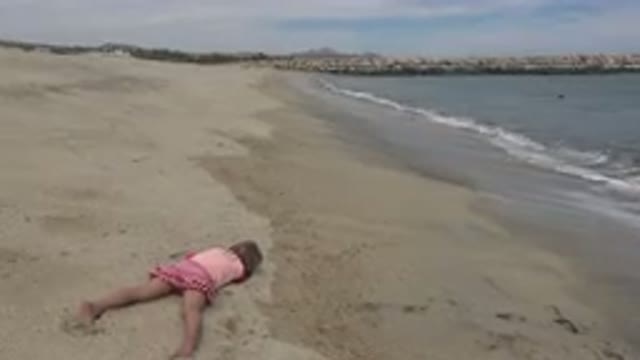 SAN JOSE DEL CABO MEXICO-2019: A Little Girl Is Playing On The Beach While The