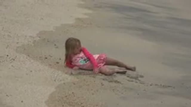 SAN JOSE DEL CABO MEXICO-2019: Girl Wearing Red Dress Lying On Beach