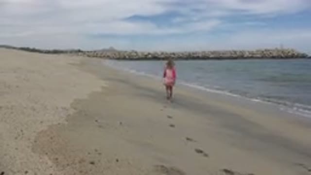 SAN JOSE DEL CABO MEXICO-2019: Little Girls Running Along The Beach Playing In