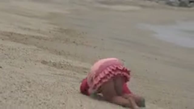 SAN JOSE DEL CABO MEXICO-2019: Tired Child Falls Asleep On Beach Sand Near