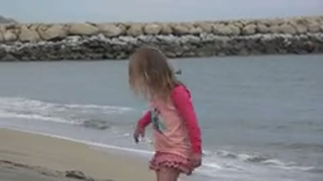 SAN JOSE DEL CABO MEXICO-2019: A Young Blonde Girl Wearing A Pink Dress Walks In