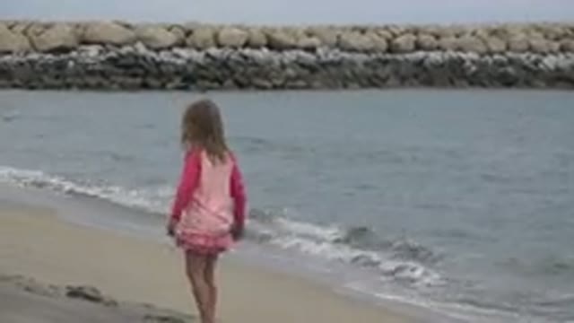 SAN JOSE DEL CABO MEXICO-2019: Young Girl Makes Footprints On Beach