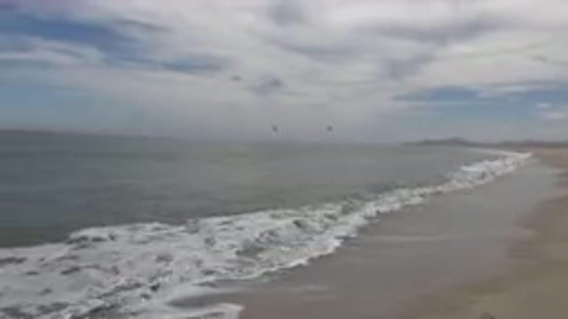 SAN JOSE DEL CABO MEXICO-2019: Calm Sea With Waves Embracing The Sandy Shore On