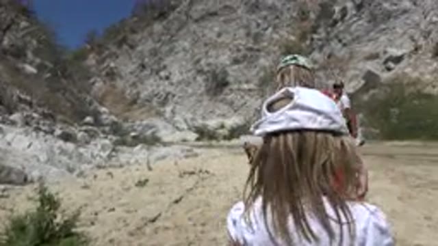 SAN JOSE DEL CABO MEXICO-2019: Girl Stumbles As She Walks Along Mountain Path