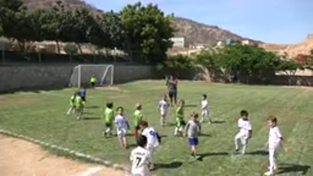 SAN JOSE DEL CABO MEXICO-2019: Two Teams of Kids Begin an Infield Play of Soccer