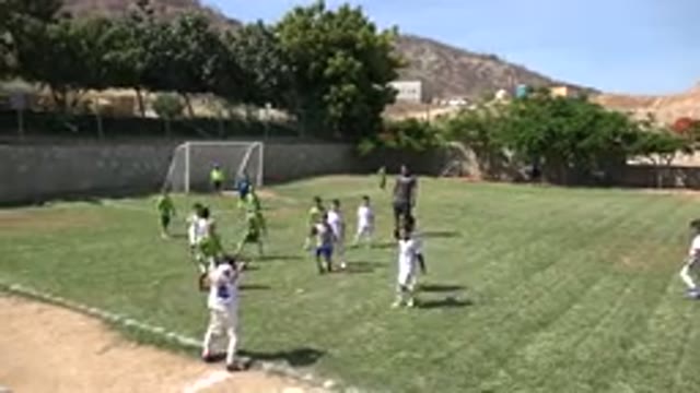 SAN JOSE DEL CABO MEXICO-2019: Two Teams Of Young Boys Playing Soccer On A Well-Maintained Field