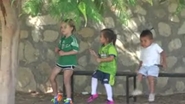 SAN JOSE DEL CABO MEXICO-2019: Three Children Sitting On A Bench Waiting To Play