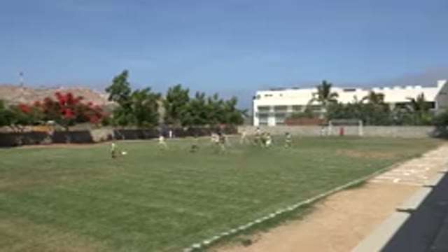 SAN JOSE DEL CABO MEXICO-2019: Boys Playing Football In An Open Green Field