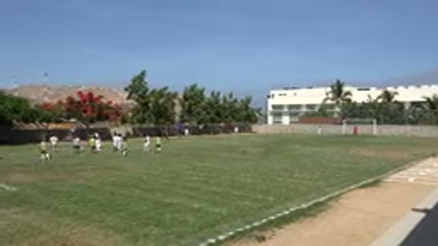 SAN JOSE DEL CABO MEXICO-2019: Boys Playing Soccer In A Field Next Some Houses