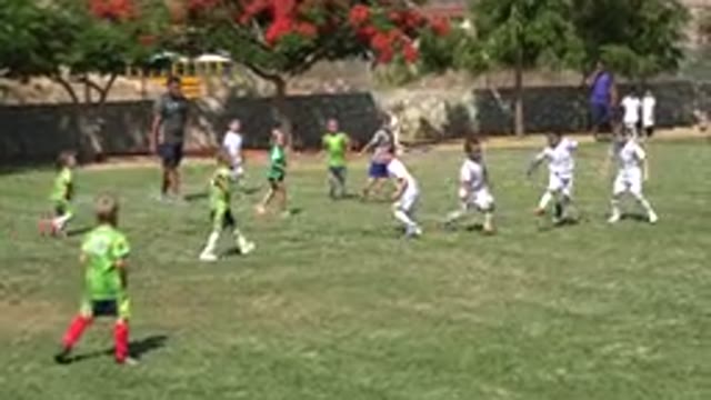 SAN JOSE DEL CABO MEXICO-2019: A Group Of Boys Playing Soccer Outside With