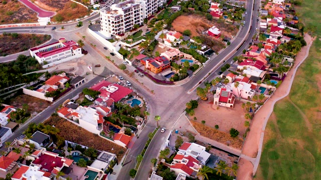 SAN JOSE DEL CABO MEXICO-2021: Vehicles Traveling Through Suburban Intersection