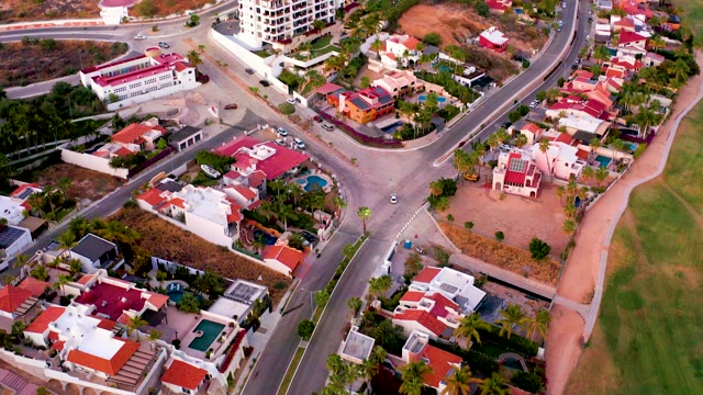 SAN JOSE DEL CABO MEXICO-2021: Car Driving Through Residential Intersection