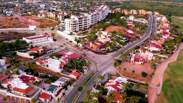 SAN JOSE DEL CABO MEXICO-2021: Residential Neighborhood with Curving Road and Buildings