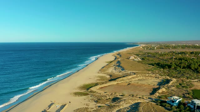 TODOS SANTOS BCS MEXICO-2021: Aerial View of a Sandy Beach with House Moving