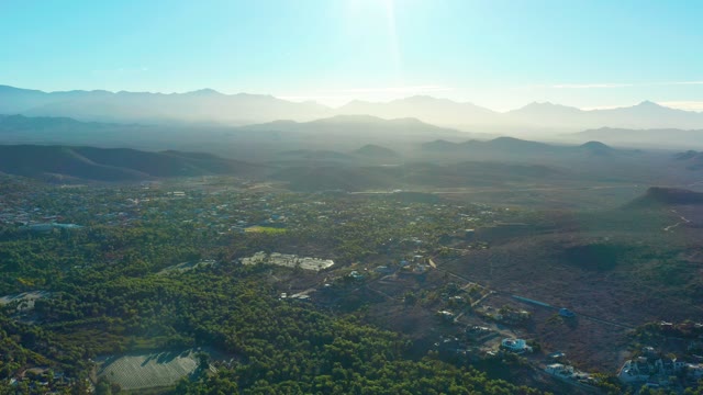 TODOS SANTOS BCS MEXICO-2021: Valley Town with Distant Mountains and Sunlight